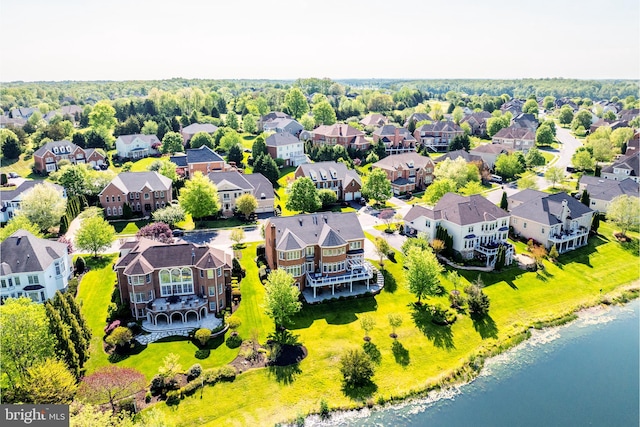 drone / aerial view featuring a residential view and a water view
