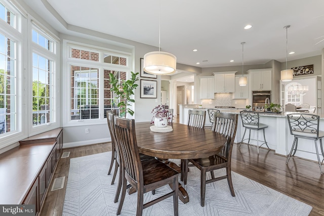 dining space with recessed lighting, baseboards, dark wood-style flooring, and visible vents