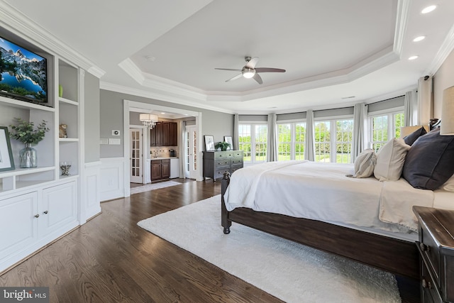 bedroom with crown molding, access to outside, recessed lighting, a tray ceiling, and dark wood finished floors