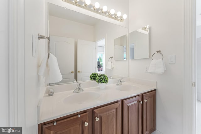 full bath featuring a sink and double vanity