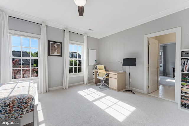 bedroom with baseboards, ornamental molding, carpet, and a ceiling fan