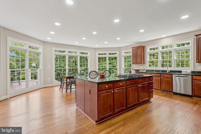8810 Primula Dr, Laytonsville, MD 20882 - kitchen with stainless steel appliances, light wood-style flooring, recessed lighting, a center island, and plenty of natural light