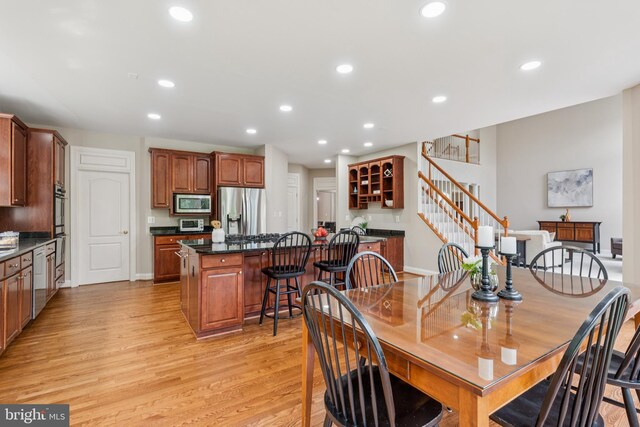 8810 Primula Dr, Laytonsville, MD 20882 - dining room featuring light wood-type flooring, recessed lighting, stairway, and baseboards