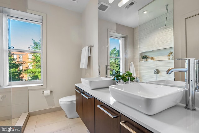 1224 11th St NW Unit 3, Washington, DC 20001 - full bathroom featuring visible vents, a sink, tile patterned floors, and toilet