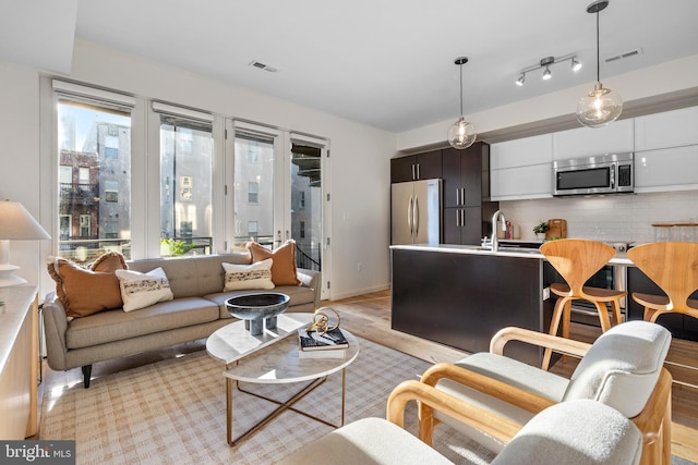 1224 11th St NW Unit 3, Washington, DC 20001 - living room with visible vents and light wood finished floors