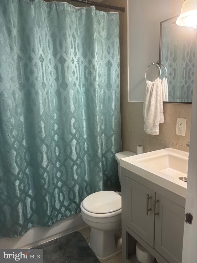 1852 Village Green Dr Unit E-122, Landover, MD 20785 - bathroom with tile walls, vanity, and toilet