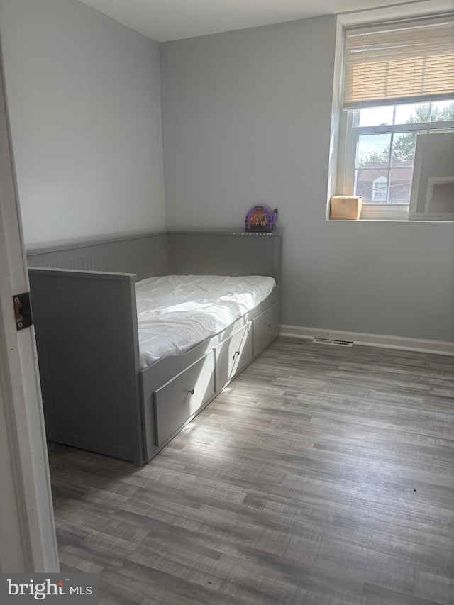 1852 Village Green Dr Unit E-122, Landover, MD 20785 - bedroom featuring baseboards, visible vents, and wood finished floors