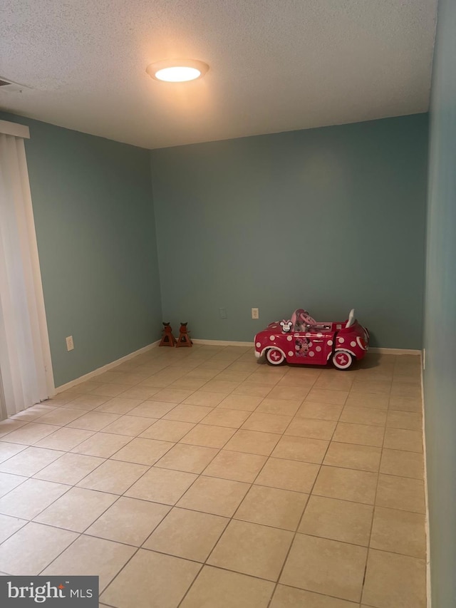 1852 Village Green Dr Unit E-122, Landover, MD 20785 - unfurnished room featuring a textured ceiling and light tile patterned flooring