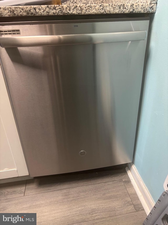 1852 Village Green Dr Unit E-122, Landover, MD 20785 - details featuring white cabinets, wood finished floors, and dishwasher