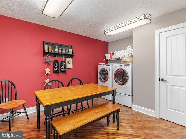 1996 Buck Mountain Rd, Bentonville, VA 22610 - dining area featuring washer and dryer, a textured ceiling, wood finished floors, and baseboards