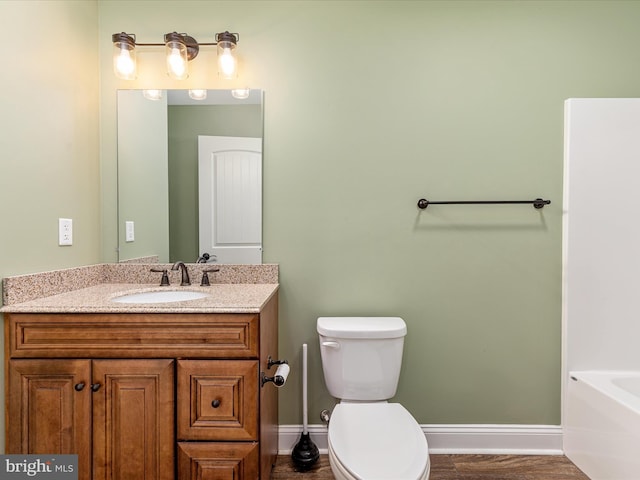 1996 Buck Mountain Rd, Bentonville, VA 22610 - bathroom featuring baseboards, vanity, a bath, and toilet
