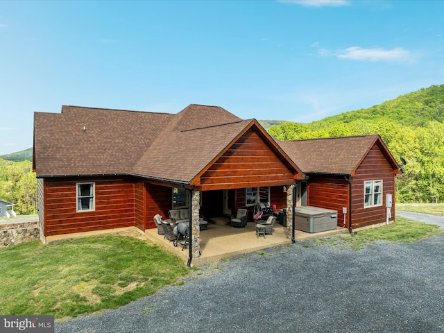 1996 Buck Mountain Rd, Bentonville, VA 22610 - chalet / cabin with a patio, roof with shingles, and a view of trees