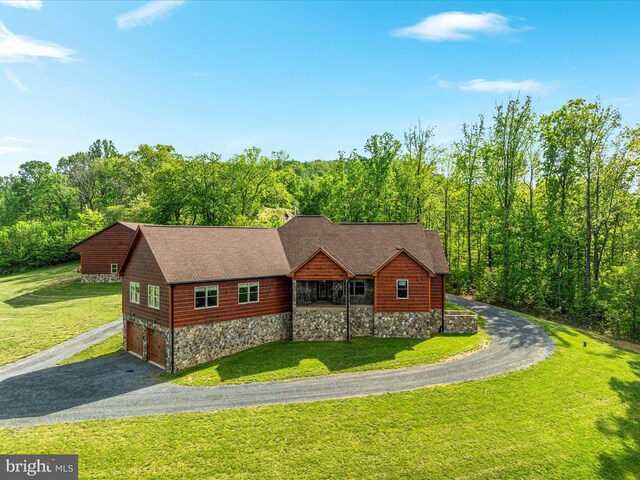 1996 Buck Mountain Rd, Bentonville, VA 22610 - view of front facade featuring driveway, stone siding, a garage, and a front lawn