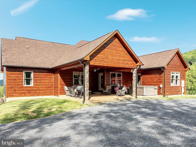 1996 Buck Mountain Rd, Bentonville, VA 22610 - view of front of property with a patio area, an outdoor hangout area, roof with shingles, and a hot tub