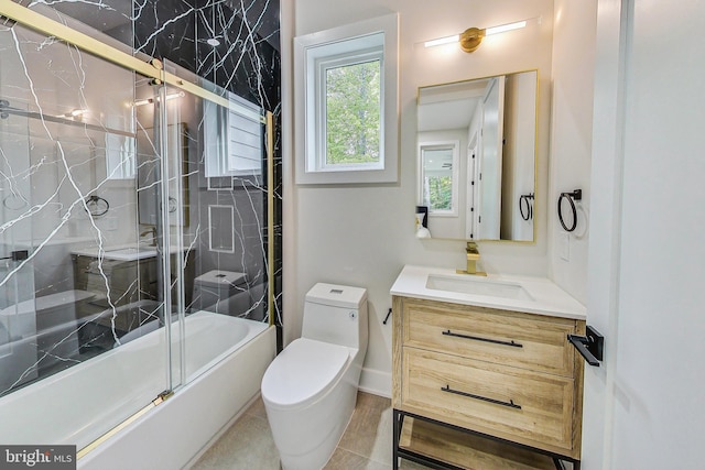 full bathroom with vanity, enclosed tub / shower combo, and toilet