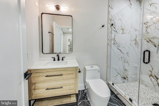 bathroom with vanity, marble finish floor, a marble finish shower, and toilet