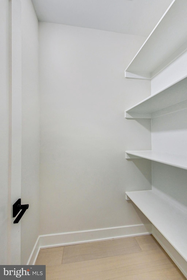 walk in closet featuring light wood-type flooring
