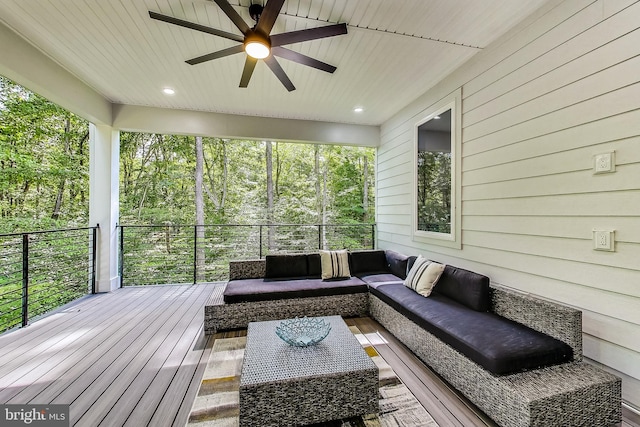 sunroom with ceiling fan and outdoor lounge area