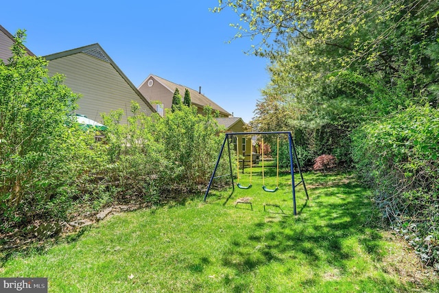 view of jungle gym featuring a yard