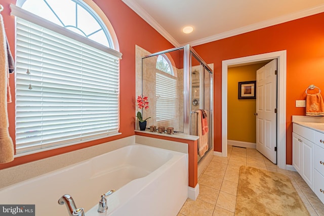 bathroom featuring tile patterned flooring, ornamental molding, a bath, and a stall shower