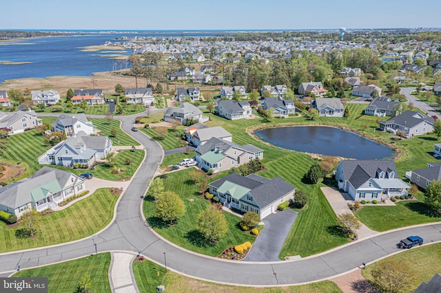 bird's eye view with a residential view and a water view