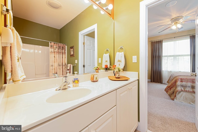 bathroom featuring vanity, a ceiling fan, and a shower with shower curtain