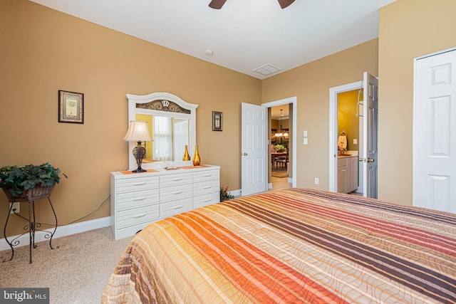 carpeted bedroom with visible vents, a ceiling fan, and baseboards