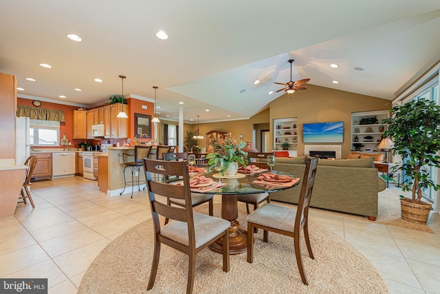 dining space featuring lofted ceiling, light tile patterned floors, ceiling fan, and recessed lighting