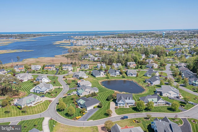 aerial view with a residential view and a water view