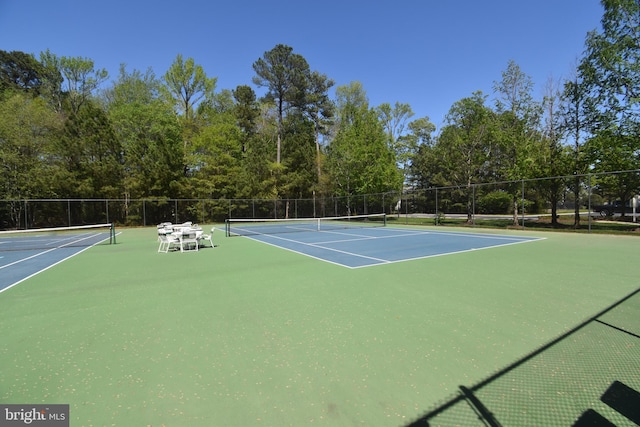 view of sport court with fence