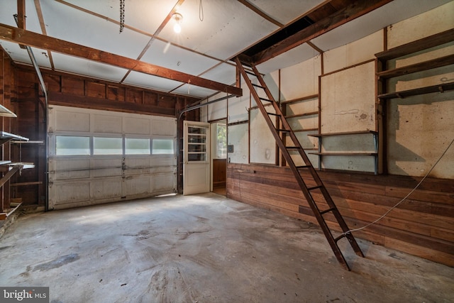 garage with wood walls