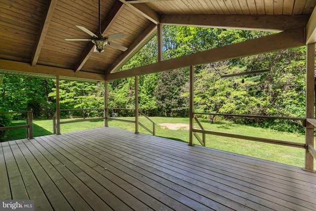 wooden deck with ceiling fan and a lawn