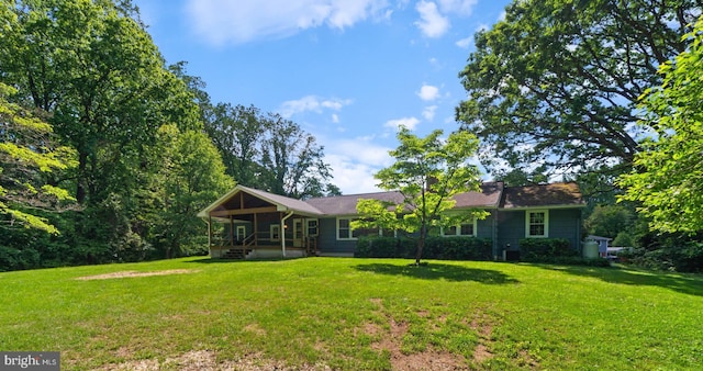 view of front of property with a front yard and covered porch