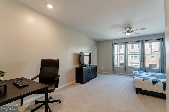 bedroom with baseboards, visible vents, and light carpet