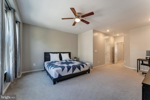 bedroom with baseboards, recessed lighting, and light colored carpet