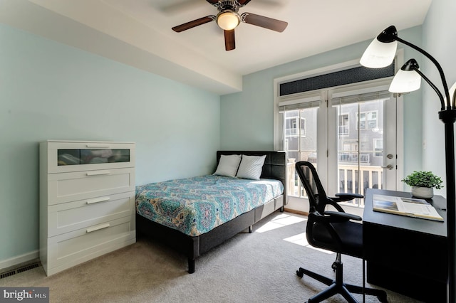 carpeted bedroom featuring baseboards, access to outside, ceiling fan, and visible vents