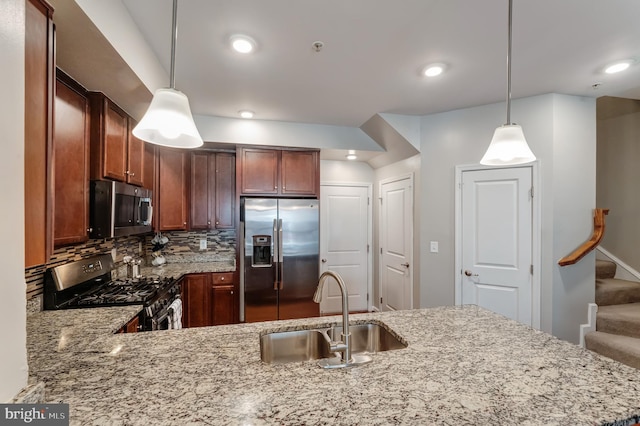 kitchen featuring decorative backsplash, a sink, light stone counters, stainless steel appliances, and recessed lighting