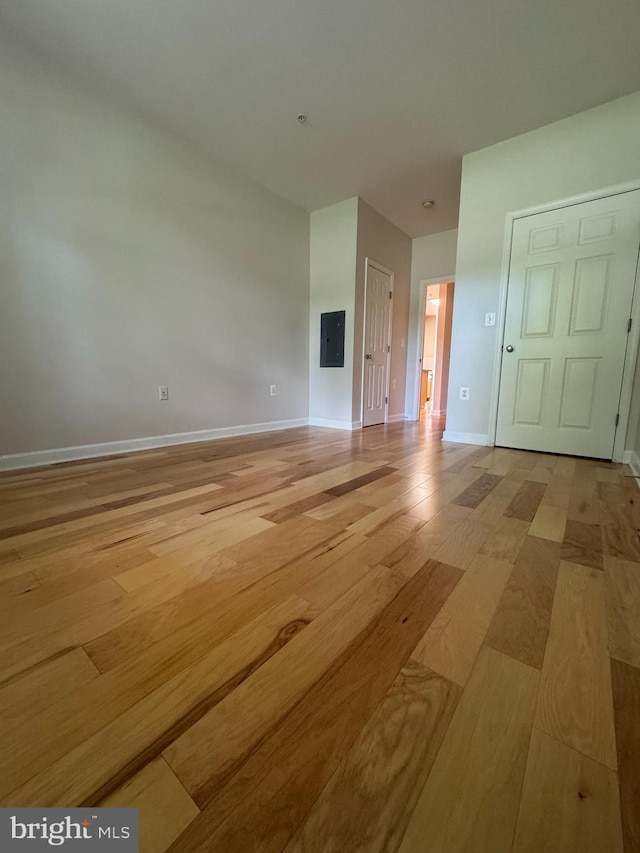 42429 Rockrose Sq, Brambleton, VA 20148 - spare room with light wood finished floors, baseboards, and electric panel