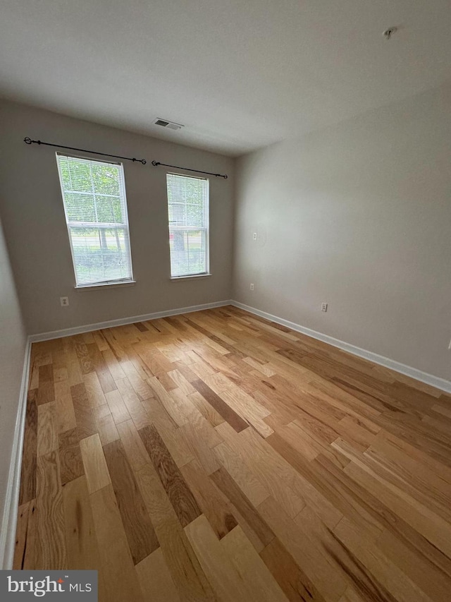 42429 Rockrose Sq, Brambleton, VA 20148 - empty room with light wood finished floors and baseboards