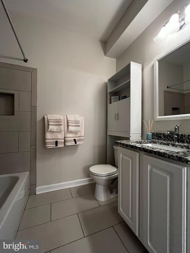 42429 Rockrose Sq, Brambleton, VA 20148 - bathroom featuring toilet, vanity, tile patterned flooring, baseboards, and shower / washtub combination