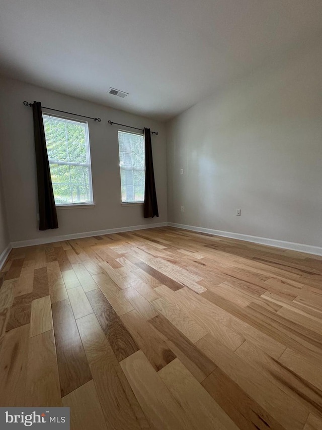 42429 Rockrose Sq, Brambleton, VA 20148 - empty room featuring light wood-style floors and baseboards