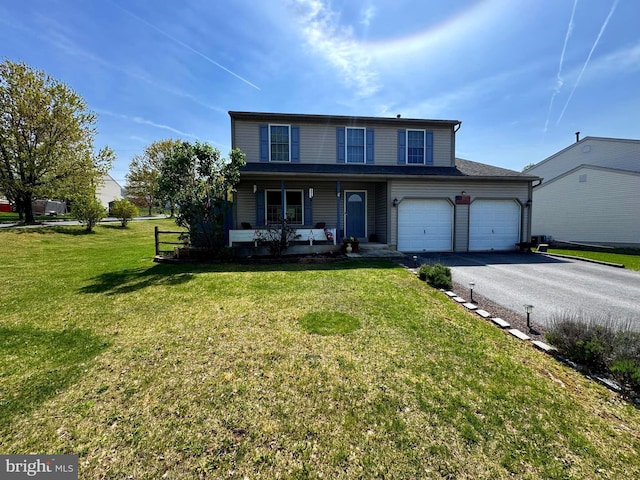 traditional home with a front lawn, covered porch, and driveway