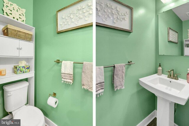 bathroom with toilet and baseboards