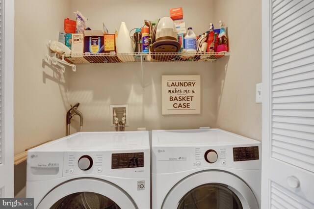 laundry area featuring washer and dryer and laundry area