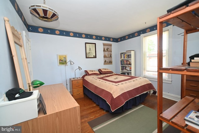 bedroom featuring wood finished floors