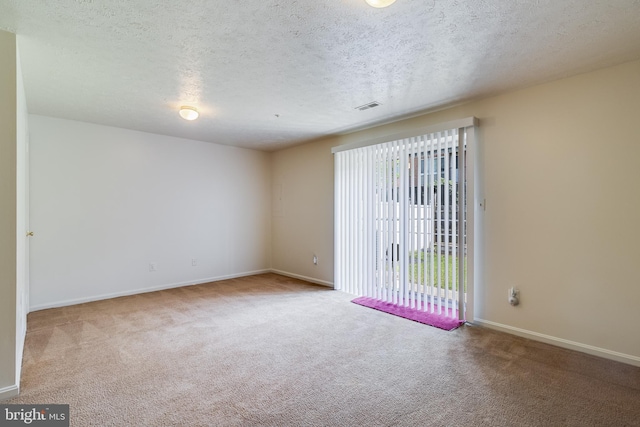 5054 Kenilworth Ave, Hyattsville, MD 20781 - spare room with carpet, baseboards, and a textured ceiling