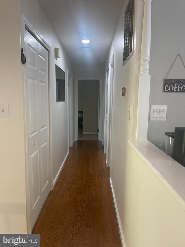 8807 Doug Dr, Nokesville, VA 20181 - hall with baseboards, dark wood finished floors, and visible vents