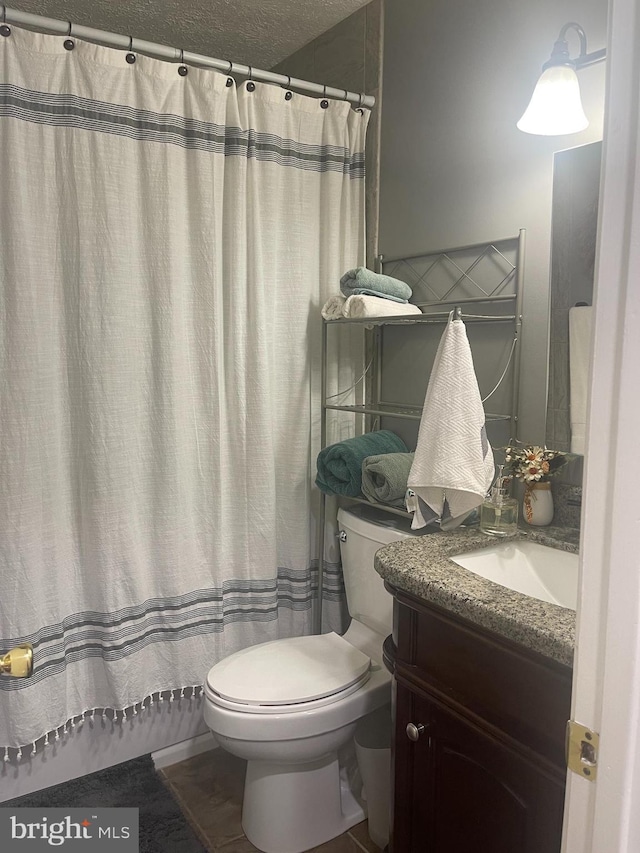 8807 Doug Dr, Nokesville, VA 20181 - full bath featuring vanity, toilet, and a textured ceiling