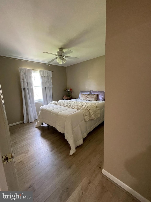8807 Doug Dr, Nokesville, VA 20181 - bedroom featuring baseboards, a ceiling fan, and wood finished floors