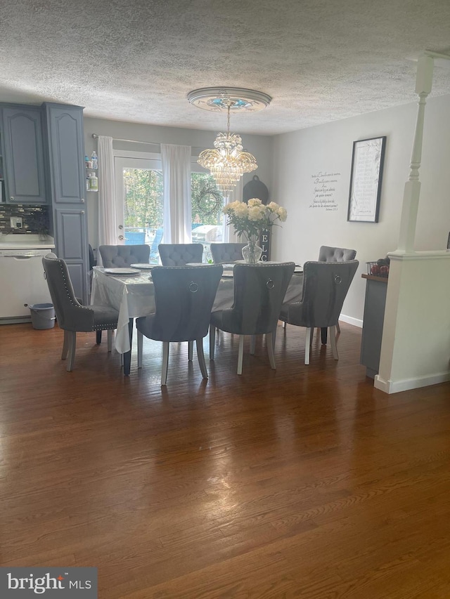 8807 Doug Dr, Nokesville, VA 20181 - dining space with a textured ceiling, an inviting chandelier, and wood finished floors